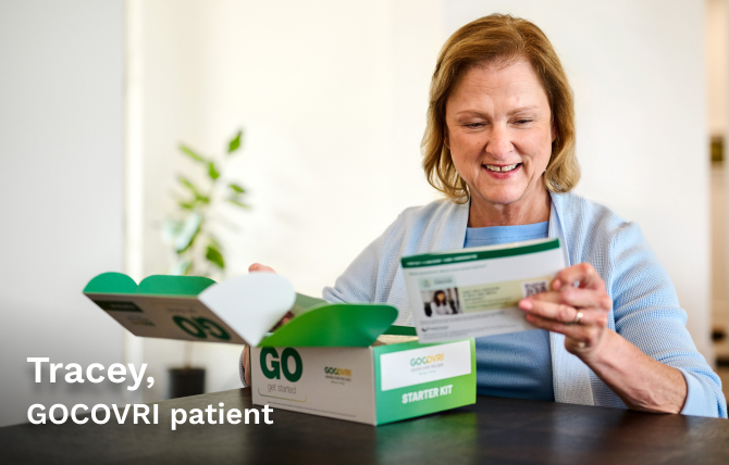 GOCOVRI patient Tracey opening a GOCOVRI Starter Kit and reading the GOCOVRI Getting Started Guide to learn all about what to expect with her treatment. 